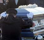 Brian Gillett, Chief of the Washington Township Fire Department said a final goodbye to Volunteer and Assistant chief engineer Mark A. Haudenschild II who was laid to rest Saturday at Riverside Cemetery. Photo by Ellie Bogue