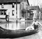 Many residents were evacuated by canoe or boat. (Photo courtesy of The History Center)