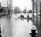 An unidentified canoeist paddled up Marion Street, east of the old Bloomingdale School. (Photo courtesy of The History Center)