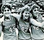 Northrop's Lori Meinerding, Jenny Bull and Cindi Westendorf celebrate after defeating Scottsburgh 58-55 in the 1986 state finals at then-Market Square Arena in Indianapolis. With this victory, Northrop captured its only state title in program history and became the first Fort Wayne-area high school girls basketball team to finish a season undefeated. Photo by The Associated Press