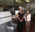 Managers Christina Filippou, left, and her sister, JoAnn Slater, stand in the kitchen and carry-out area of their family's restaurant, The Rib Room, in the East State Village area near State Boulevard and Crescent Avenue. The restaurant did not open for lunch Wednesday because of the heavy snow, but they opened at 4:30 p.m. and hoped for a good crowd for dinner. (By Kevin Kilbane of The News-Sentinel)