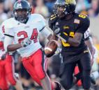 Snider’s Quinton Daniels, 81, keeps an eye on Luers’ C.J. McArter as he runs the ball during the first quarter of Friday night’s home game at Snider with Bishop Luers. Snider won, 10-7. (By Ellie Bogue of The News-Sentinel)