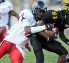 Bishop Luers’ Jaylon Smith tries to put the brakes on Snider’s Quinton Daniels in the the third quarter of Friday nights home game at Snider with Bishop Luers. Snider won, 10-7. (By Ellie Bogue of The News-Sentinel)