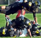 Bishop Luers’ Channing Williams is brought down by Snider defensive players, Jibri Bramley,8, Deronta Smith, 14, Pascal Sylla,41 and Dumont Schmidt,18, in the first quarter of Friday nights home game at Snider with Bishop Luers. Snider won, 10-7. (By Ellie Bogue of The News-Sentinel)