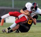 Bishop Luers’ quarterback Noah Wezensky gets sacked by Snider’s Donavin O’Day in the the third quarter of Friday night’s home game at Snider with Bishop Luers. Snider won, 10-7. (By Ellie Bogue of The News-Sentinel)