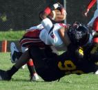 Bishop Luers’ Jaylon Smith gets pulled down by Snider’s Donavin O’Day in the the first quarter of Friday nights home game at Snider with Bishop Luers. Snider won, 10-7. (By Ellie Bogue of The News-Sentinel)