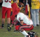 Bishop Luers’ Andrew Spencer took a moment after loosing to Snider Friday night, 10-7. (By Ellie Bogue of The News-Sentinel)