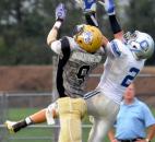 New Haven's Elliott Nelson applies pressure to Carroll’s Drue Tranquill, Tranquill did not make the catch, during the first quarter of Friday night’s game at New Haven. The game was called in the third quarter due to lightening and will resume Saturday at 3 p.m. (Photo by Ellie Bogue of The News-Sentinel)