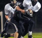 Garrett’s Austin McCRay tackles Leo’s Fazaun Stephens Friday night in the third quarter when took on Garrett took on Leo. Garrett won 20-6. (By Ellie Bogue of The News-Sentinel)