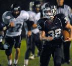 Garrett’s Austin McCRay runs in a touchdown Friday night when Garrett took on Leo. Garrett won 20-6. (By Ellie Bogue of The News-Sentinel)