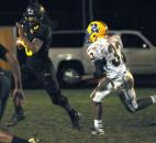 Snider’s Nicolas Reese puts some yards on the ball in the second quarter for Snider. Snider beat Homestead Friday night 30-20. (By Ellie Bogue of The News-Sentinel)