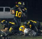 Snider’s Je’Norie Smith runs the ball in the second breaking away from the pack. Snider beat Homestead Friday night 30-20. (By Ellie Bogue of The News-Sentinel)