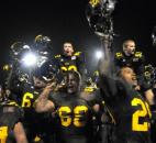 Snider celebrates at the end of the game with the fans in the stands. Snider beat Homestead 30-20. (By Ellie Bogue of The News-Sentinel)