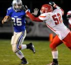 Carroll's James Crumley tries to fend off South Bend Adams'  Kenan Boyd during  the second quarter of Friday night's game at Carroll High School. Carroll won 44-35. Photo by Ellie Bogue of The News-Sentinel