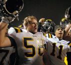 Snider celebrates their victory over North Side Friday night, left is  Andrew Meyers and right is Sedrick Hides. Snider won the game 24-14. Photo by Ellie Bogue of The News-Sentinel