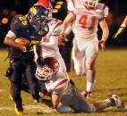 Snider Tyrell Swain runs the ball for a few yards in the fourth quarter Friday night. The beat Fishers in overtime by a two point conversion. Photo by Ellie Bogue