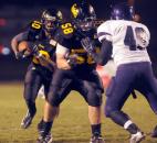 Snider's Andrews Meyers blocks for Je'Noire Smith in the second quarter of Friday night's game. Snider beat Merrillville, 42-39, and will advance to IHSAA State finals next weekend in Indianapolis. Photo by Ellie Bogue