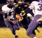 In the second quarter Snider's Brandon Phelps runs the ball on a quarterback  keeper. Snider beat Merrillville, 42-39, and will advance to IHSAA State finals next weekend in Indianapolis. Photo by Ellie Bogue