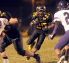In the fourth quarter Tyrell Swain  runs the ball for some yards. Snider beat Merrillville, 42-39, and will advance to IHSAA State finals next weekend in Indianapolis. Photo by Ellie Bogue
