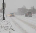 Cars make their way slowly along East State Boulevard east of Crescent Avenue shortly after 5 p.m. Monday, Feb. 17. The heavy snow caused limited visibility and left roads snow-covered. (By Kevin Kilbane of The News-Sentinel)