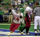 Running back Tucker Benedict celebrates after scoring a touchdown as Southern Wells defeated Perry Central 30-7 in the 2001 Class A state finals at the RCA Dome in Indianapolis. Benedict – who played in the state championship game after sustaining a concussion one week earlier in a semistate win against Pioneer – had a game-high 120 yards rushing and two touchdowns to lead Southern Wells to the school's only state title. (News-Sentinel file photo)