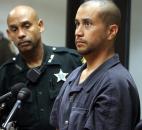 George Zimmerman, right, stands with a Seminole County Deputy during an April court hearing in Sanford, Fla.  Zimmerman was charged with second-degree murder in the shooting death of &quot;7-year-old Trayvon Martin. Zimmerman claimed self-defense in the killing, which shocked and angered many across the nation. Photo by The Associated Press