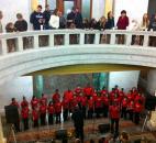 Listeners on the second floor of the Allen County Courthouse enjoy a performance from the Voices of Unity choir. Photo by Brad Saleik