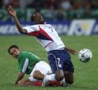United States player DaMarcus Beasley, front, is tackled by Mexico's Juan Pablo Garcia during their semifinal pre-Olympic U23 soccer match celebrated at the Jalisco Stadium Tuesday, Feb. 10, 2004, in Guadalajara City, Mexico. 