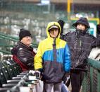 Kevin, Tyler and C.J. Rebman sit through the cold rain, making sure to not miss a minute of the TinCaps' home-opener win against the Lake County Captains. (Photo by Gannon Burgett for The News-Sentinel)