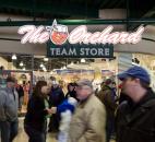 TinCaps fans walk by The Orchard, the TinCaps’ store at Parkview Field, as the umpires call off the game. (Photo by Gannon Burgett for The News-Sentinel)