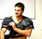 In November 2011, Colin Chaulk shows off shoulder pads he has worn for more than 20 seasons. (File photo by Blake Sebring of The News-Sentinel)
