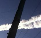 In this photo taken with a mobile phone camera, a meteorite contrail is seen Friday in Russia's Chelyabinsk region.