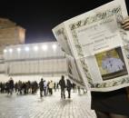 A reader looks at the first edition of the Vatican newspaper L'Osservatore Romano after Wednesday's election of Pope Francis. (Photo by The Associated Press)