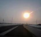In this frame grab from a dashboard video camera provided by the Nasha Gazeta newspaper, a meteorite contrail is seen Friday from a Russian highway.