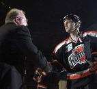 Komets captain Colin Chaulk shakes hands with Komets GM David Franke on Oct. 25, 2003, during pregame ceremonies for the team's home opener. Fort Wayne rallied but eventually lost to Kalamazoo in a shootout. (News-Sentinel file photo)