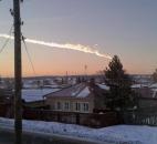 In this photo provided by E1.ru, a meteorite contrail is seen Friday over the Russian village of Bolshoe Sidelnikovo.