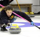 Nov. 23, Kaya Ray, 12, releases a stone down the course during a session at the Fort Wayne Curling Club. (Photo by Ellie Bogue of The News-Sentinel).