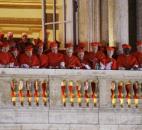 Cardinals watch as Pope Francis speaks to the crowd Wednesday at  St. Peter's Basilica at the Vatican. (Photo by The Associated Press)