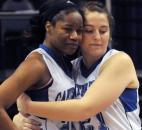 Canterbury's Kindell Fincher gets a hug from teammate Emma Hyndman at the end of the game with Heritage Christian. Canterbury fell to Heritage Christian 61-64 in Terre Haute Saturday during the Class 2A IHSSA Girls Basketball State Final.