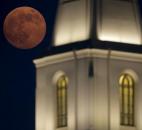 A full moon rises beyond a Latter-day Saints temple Saturday in Kansas City, Mo.  