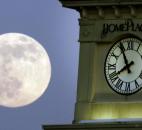 A supermoon rises behind the Home Place clock tower Saturday in Prattville, Ala. 