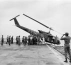 In this Tuesday, April 29, 1975 file photo, U.S. Navy personnel aboard the USS Blue Ridge push a helicopter into the sea off the coast of Vietnam in order to make room for more evacuation flights from Saigon. The helicopter had carried Vietnamese people fleeing Saigon as North Vietnamese forces closed in on the capital. (AP Photo/File)