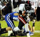Bishop Luers Michael Rogers breaks the tackle of Tipton's Gunnar Norred as Rogers gains extra yards during regional football action Friday evening at Tipton. Photo by Rob Edwards