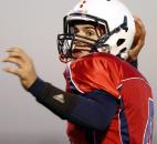 Heritage quarterback Conner Sheehan drops back to pass for a 82-yard touchdown during the first quarter of the Patriots' game against Garrett on Friday at Heritage. Photo by Chad Ryan