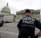 A law enforcement officer stands post at the U.S. Capitol on Monday in Washington. Authorities say the blasts during the Boston Marathon killed three people and injured at least 140. Photo by By The Associated Press
