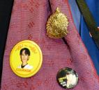Fred Gilbert, who works with local Burmese, wears a number of Aung San Suu Kyi-related items. By Lisa Esquivel Long 