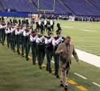 Director James Graham leads the Eastside Marching Pride from the field after presenting "The Firebird" in Class D competition. The band finished in 10th place. Photo by Garth Snow