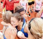 The Carroll 3,200-meter relay squad congratulates each other after their race. (Photo by Gannon Burgett for The News-Sentinel)