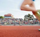 A competitor runs past the grandstand during the 3,200-meter race. (Photo by Gannon Burgett for The News-Sentinel)