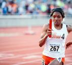 Northrop's Dejah Arnold sprints toward the starting line before handing the baton off to a teammate during a relay race. (Photo by Gannon Burgett for The News-Sentinel)